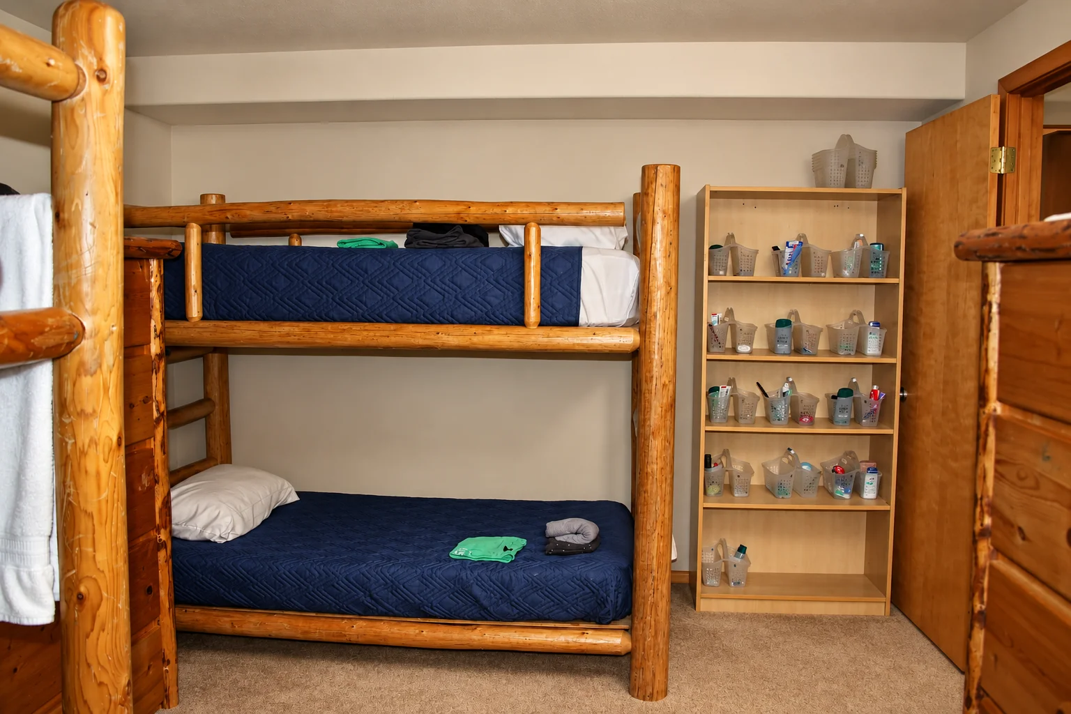 Wooden bunk beds and storage shelves in a campus bedroom