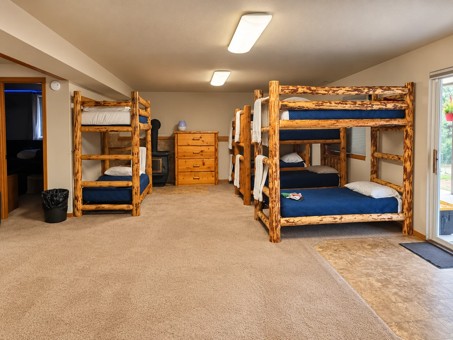 Shared bedroom with wooden bunk beds and dressers