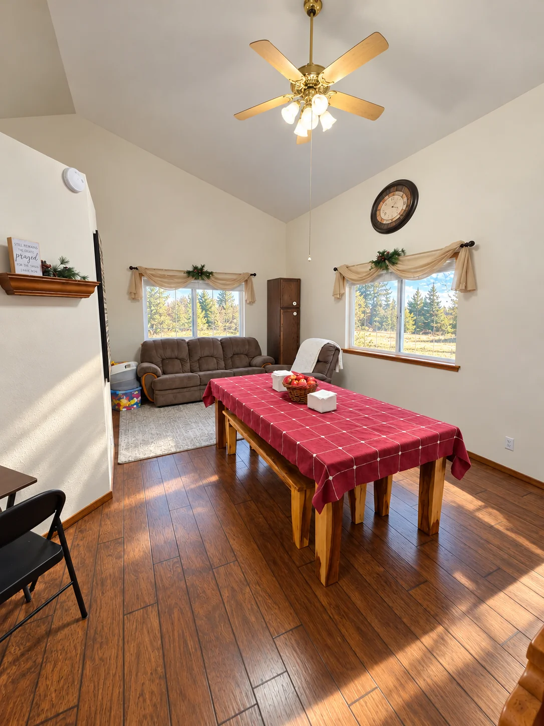 Dining room with a red table and wooden chairs