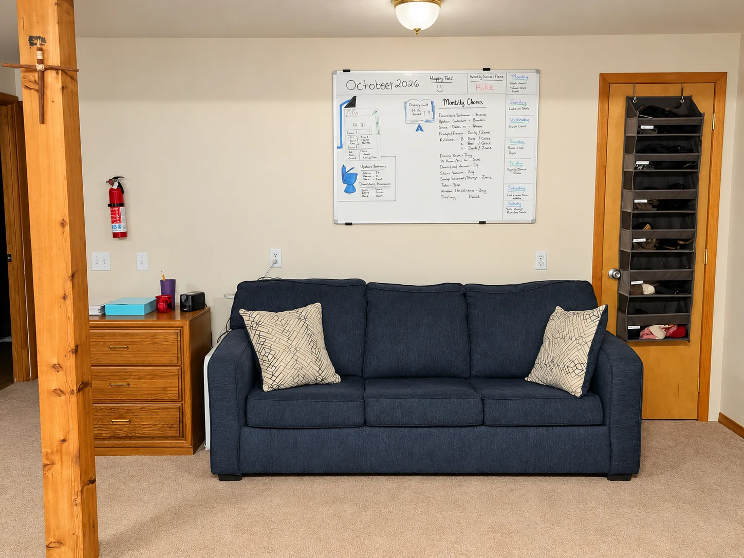 Campus sitting area with a sofa and whiteboard